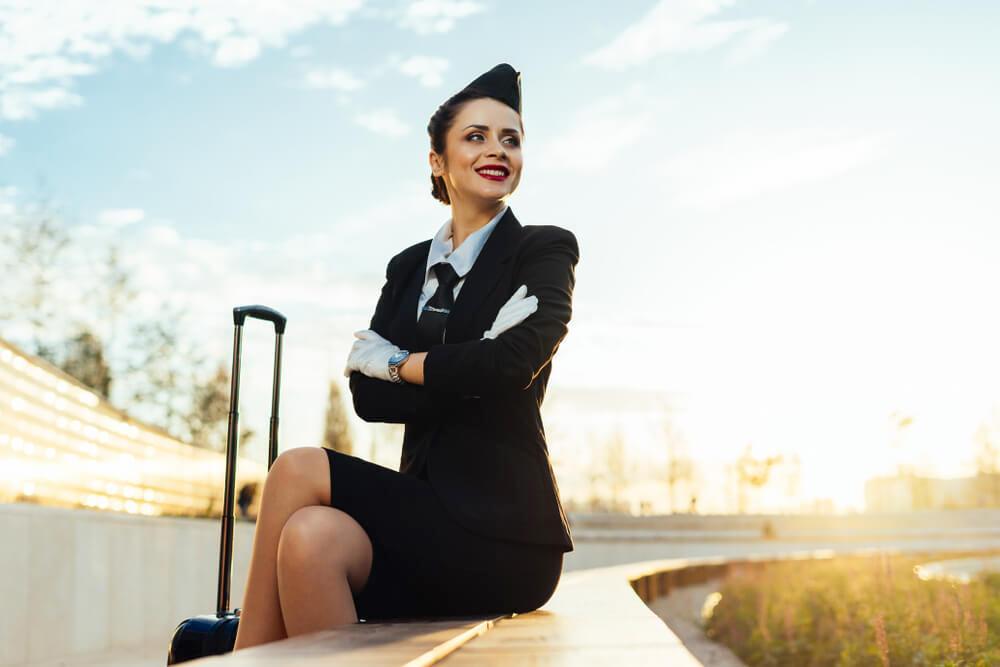 Smiling flight attendant in uniform