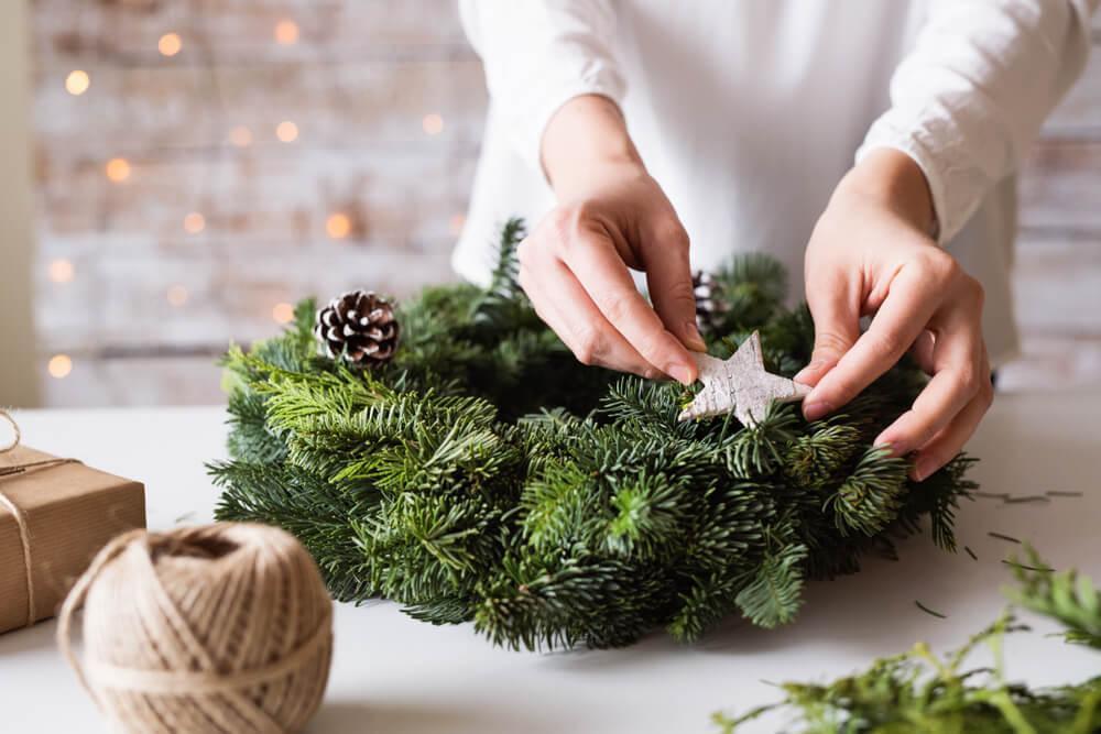 Unknown woman creating Christmas wreath