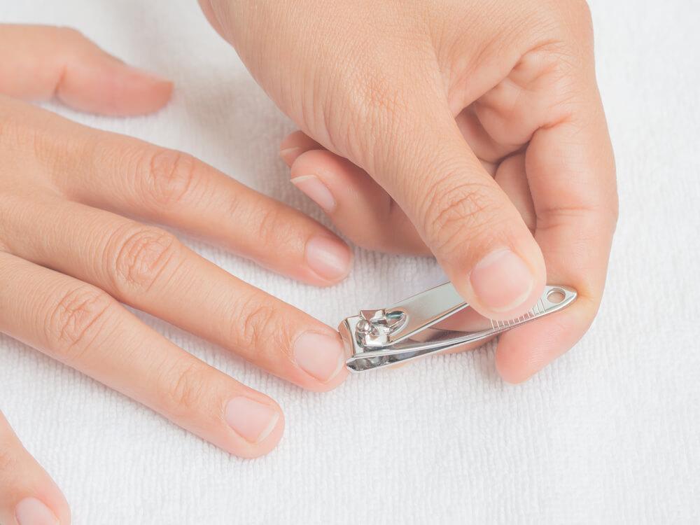 Trimming fingernails with clippers