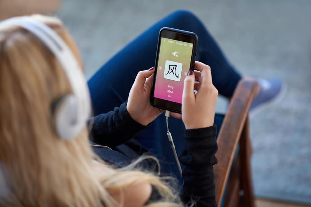 Woman using language app on phone