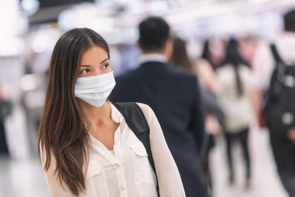 Woman wearing face mask at airport