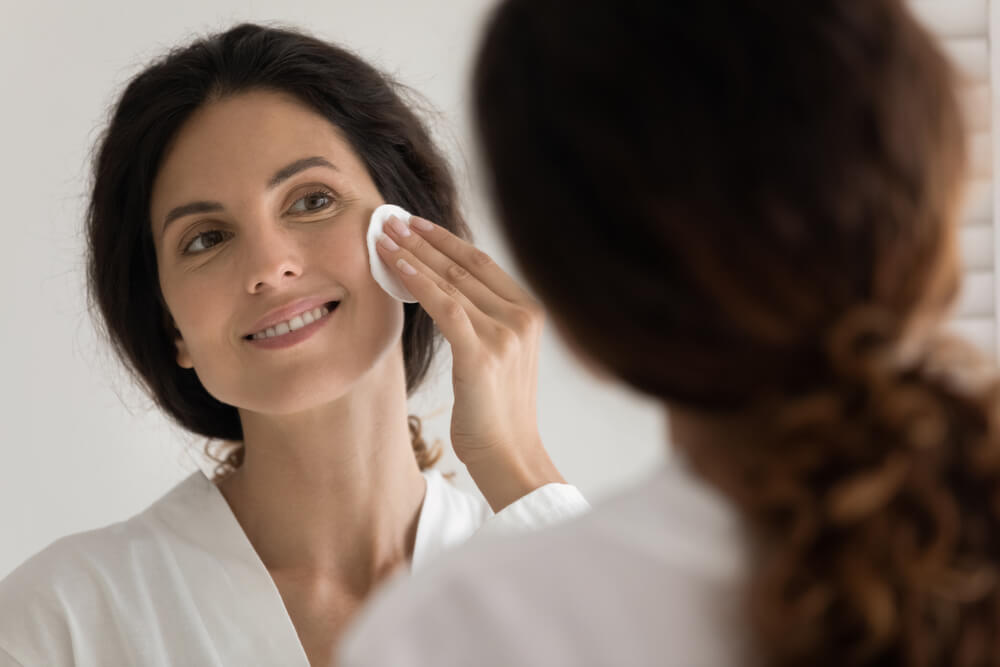 woman cleaning face