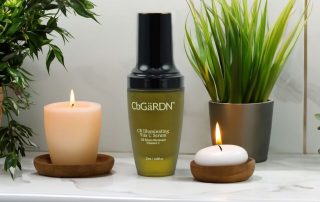 CbGardn vitamin C serum next to candles and plants